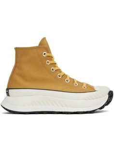 Converse 
Yellow Chuck 70 AT-CX Sneakers 
High-top cotton twill sneakers in yellow. Faux-leather logo patch at inner side. 
. Round textured rubber cap toe 
. Lace-up closure 
. Canvas lining 
. Padded CX foam footbed 
. Foam rubber platform midsole 
. Treaded rubber outsole 
. Platform: H1.5 in 
Supplier color: Burnt honey/Thriftshop yellow 
Upper: textile. Sole: rubber. 
Made in Viet Nam. 
231799M237062 
Yellow Chuck 70 AT-CX Sneakers default         Sports & Outdoor Shoes, size features are:B Burnt Honey, Converse Yellow, Casual Athletic Shoes, Chuck 70, Thrift Shopping, Leather Logo, Outdoor Shoes, Sports Equipment, High Top