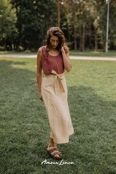 Wrap Linen Skirt: A boho style and minimal aesthetics. This skirt, adorned with a charming bow, is your ticket to effortless elegance. It's the go-to choice for fall looks for women, whether you're embracing casual chic or seeking the perfect party look. Perfect for work or a casual evening out outfit. IRIS is not just a trendy fall outfit; it's the ideal choice for fall weddings, date nights. Add this piece to your capsule wardrobe and enjoy free shipping on orders over $100! Elegant Linen Pencil Skirt, Elegant Relaxed Wrap Skirt, Elegant Wrap Skirt With Relaxed Fit, Summer Flared Skirt With Tie Waist, Spring Wrap Skirt With Tie Waist, Spring Midi Wrap Skirt With Tie Waist, Spring Tie Waist Midi Wrap Skirt, Elegant Summer Wrap Skirt With Lining, Summer Relaxed Tie Waist Skirt