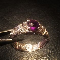 This is a handmade sterling silver ring with a deep purple Amethyst on a prong setting. Notice the detail and unique quality in the wrapped band. If your searching for a unique ring, you've found it!  The ring(s) pictured is for illustration purposes to give you an idea of how your ring will look. Each ring is handmade using natural pearls, thus having a unique quality of its own.  Thickness and shape of the pearl or width of the band may slightly vary. Checkout my shop policies to include jewelry care and shipping: https://www.etsy.com/your/shops/angieww/policies FAQ Q). Can I get this order in a different size not listed? A). US sizes 3-15 are available. If there is no option for US size 3-15, just send a note at checkout indicating the size needed. However, if you need a size other than Purple Ring, Rustic Ring, Bijoux Fil Aluminium, Diamond Cluster Engagement Ring, Purple Rings, Handmade Sterling Silver Rings, Antique Ring, Engagement Rings Opal, Ring Antique