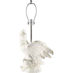 a white bird lamp with a black base