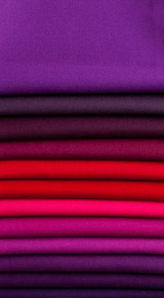 a stack of purple and red sheets