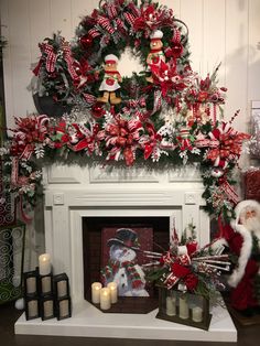 a mantel decorated with christmas decorations and candles