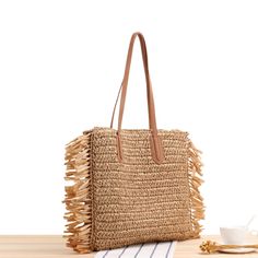 Elena Handbags Large Straw Woven Tote Bag with Tassels and Leather Strap Size: 40cm wide x 38cm tall. (16in x 15in) Designer Style ID: 8220 Large Straw Woven Tote Bag, Summer Bag, Everyday Shoulder Bag, Beach Bag Luxury Beige Jute Beach Bag, Square Shoulder Bag For Beach Season, Square Shoulder Bag For Beach Season Shopping, Trendy Vacation Bag With Fringe, Trendy Fringe Vacation Bag, Trendy Vacation Shoulder Bag With Fringe, Bohemian Style Bags For Beach Season Shopping, Bohemian Beach Bags For Shopping, Trendy Fringe Shoulder Bag For Vacation