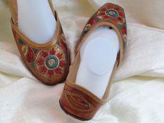 Colorful, embroidered women’s leather shoes and sandals from India: Fashion footwear for the contemporary city dweller, from five centuries back. Mumtaz, the lady for whom the Taj Mahal was built probably lived in shoes and sandals much like these. Originally meant for the Maharajahs and the Maharanis [Kings and Queens and such royalty], these handcrafted fashion footwear for men and women mainly come from the villages of Punjab and Rajasthan. This period fashion piece was introduced to India du Period Fashion, Shoes And Sandals, The Taj Mahal, Sandals Casual, Embroidered Leather, Fashion Footwear, Summer Boho, Tory Burch Flats, India Fashion