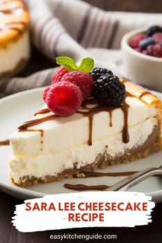 a slice of cheesecake on a white plate with chocolate sauce and raspberries