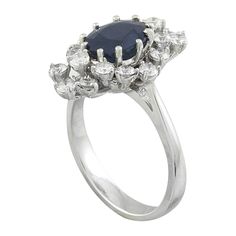 Stamped: 14K Total Ring Weight: 5.4 Grams Sapphire Weight 2.25 Carat (9.00x7.00 Millimeters)Diamond Weight: 1.00 carat (F-G Color, VS2-SI1 Clarity )Face Measures: 19.75x13.17 Millimeter SKU: [601131] Classic Sapphire Ring In 14k White Gold, Classic Oval Sapphire Ring With Prong Setting, Marquise Sapphire Ring In White Gold With Vvs Clarity, Marquise White Gold Sapphire Ring With Vvs Clarity, White Gold Marquise Sapphire Ring With Vvs Clarity, Formal Cluster Sapphire Ring With Vvs Clarity, Luxury Marquise Cluster Ring For Formal Occasions, Formal Vvs Clarity Cluster Sapphire Ring, Classic Platinum Diamond Ring With Gemstone