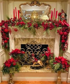 a fireplace decorated for christmas with red and green decorations