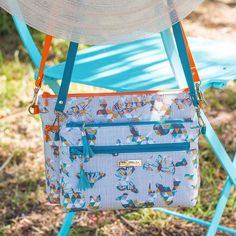 a purse sitting on top of a blue chair