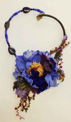 Peony. Romantic a jewelry necklace, handmade from lilac beads, supplemented with agate, lazurite, corals, unakite. Beautiful lilac flower.  Necklace: length 33cm(12,8in),flower diameter 12cm(4,8in), neck circumference up to 50 cm(20in). The flower is made of Japanese pearls. The color that you see may be slightly different from the actual color, each photo camera and computer monitor reproduces colors differently Blue Flower-shaped Beaded Necklace Gift, Handmade Blue Flower Beaded Necklaces, Handmade Blue Flower Beaded Necklace, Blue Flower Shaped Beaded Necklace For Gift, Handmade Blue Flower Pendant Necklace, Elegant Flower-shaped Beaded Necklaces With Colorful Beads, Elegant Flower Necklace With Colorful Beads, Elegant Flower-shaped Necklace With Colorful Beads, Elegant Flower Shaped Beaded Necklace With Colorful Beads