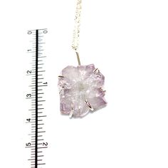 "If you love our raw stone jewelry, this necklace is for you! A delicate sterling silver curb chain is adorned with a raw natural lavender amethyst flower. This iridescent stone is set in a sterling silver prong setting. The chain is adjustable from 15.5\" to 17.5\" (not including the stalactite drop). Love! xoxoxo payton All FizzCandy creations come beautifully boxed and ready for gift giving. Please see our store policies here - https://www.etsy.com/shop/FizzCandy/policy?ref=shopinfo_policies_ Raw Stone Pendant Jewelry As Gift, Raw Stone Pendant Jewelry For Gifts, Gemstone Flower Pendant Necklace For Healing, Sterling Silver Pendant Crystal Necklace With Adjustable Chain, Delicate Healing Pendant Jewelry, Sterling Silver Pendant With Raw Stone, Unique Raw Jewelry For Gifts, Healing Pendant Necklace With Raw Stone, Delicate Natural Stone Jewelry For Healing