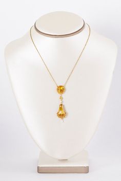 Got YELLOW?  We do in this outstanding brighter than bright 18 k yellow and rose gold Victorian citrine and seed pearl dangle pendant necklace.  Each citrine stone is cradled within a floral wreath design.  So elegant and lively at the same time!  Would you wear this on your wedding day?  We think it would be the perfect antique bridal adornment but we also think it could be your new signature piece!  Antique Necklace - Antique Victorian 1890-1900 18k Two-Tone Citrine & Seed Pearl NecklaceCi Antique Yellow Gold Jewelry With Detachable Pendant, Victorian Necklace With Detachable Pendant, Victorian Necklaces With Detachable Pendant, Victorian Yellow Gold Dangle Jewelry, Hallmarked Citrine Necklace In Yellow Gold, Art Nouveau Yellow Gold Jewelry With 17 Jewels, Gold Art Nouveau Necklace With Gemstone, Art Nouveau Gold Necklace With Gemstone, Victorian Yellow Gold Necklace With Pearl Pendant