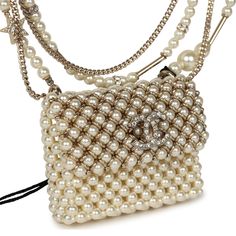 This Chanel flap bag pendant necklace is made of pearls with light gold tone hardware and features a front flap with signature CC magnetic closure, and a light gold tone chain link with pearl, CC pendants, and star pendants.Collection: 23AOrigin: FranceCondition: New and never wornAccompanied by: Chanel pouch, retail UPC and carebookMeasurements: 2" x 1.75" pendant; 23.5" chain length Chic Evening Pearl Necklace, Luxury Gold Pearl Necklace For Evening, Elegant Pearl Necklace With Chain For Evening, Luxury Pearl Necklace With Chain, Luxury Formal Pearl Necklace With Chain, Luxury Pearl Pendant Necklace For Party, Luxury Jewelry For Events, Luxury Pearl Necklace With Pearl Charm For Parties, Elegant Gold Bag With Pearl Chain