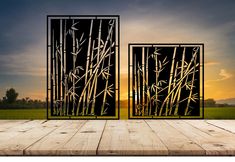 an image of two doors that have bamboo on them in front of the sun setting