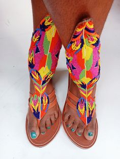 Extra long gradiator, African beaded sandal, women shoes, leather sandal, wedding shoes, summer sandal, handmade sandals, multi colour Sandals  Better quality materials Long lasting quality guarantee Superior fit Best for wedding, parties and other occasions  Very beautiful and unique Very durable and stylish 100% handcrafted using genuine leather and fine beads Best for outdoor trip  We ship via DHL express For wholesale please contact us Multicolor Open Toe T-strap Sandals For Summer, Summer Multicolor Open Toe T-strap Sandals, Multicolor Open Toe Heels For Festival, Traditional High Heel Sandals For Spring, Bohemian Open Toe Heels For Festival, Bohemian High Heel Sandals For Summer, Beaded Open Toe Sandals For Party, Bohemian Multicolor Closed Toe Heels, Multicolor Embellished Open Toe Heels