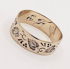 Amazing Original Antique 1800s Edwardian 10k HAND CARVED, Stamped Yellow Gold Ring. Stackable Aniversary, Eternity, Wedding band. COULD ALSO BE A PINKY, MIDI OR BABY Ring! Loaded with hand-carved, stamped floral leaf detail. It's almost medieval looking. One way or another its super neat, unique and interesting The design goes all the way around the entire band. This amazing ring is made of 10k yellow gold. It's not marked but does test 10k.  It is also engraved E. F. on the inside of the band, pictured. It is 4.8mm wide. EXCELLENT example of VERY early period jewelry. It's in nice antique condition, design is vivid. Please note, it is slightly out of round, which is not noticeable when worn. Currently the  ring is SIZE 3½. Personally I would not resize this ring BUT it could be resized by Heirloom Etched Jewelry For Wedding, Heirloom Etched Wedding Jewelry, Heirloom Etched Wedding Bands, Heirloom Ceremonial Engraved Ring With Decorative Band, Heirloom Engraved Ring With Decorative Band For Ceremonial Occasions, Heirloom Etched Jewelry For Marriage, Victorian Engraved Ring With Decorative Band For Anniversary, Antique Engraved Ring With Decorative Band For Ceremonial, Antique Engraved Ring With Decorative Band For Ceremonial Occasions