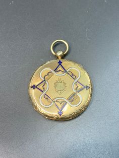 Measurement: 5.5 cm by 4.5 cm by 0.7 cm Metal: 14k Gold Weight: 16.7 Grams *Some enamel missing on not sides of locket Blue Enamel Locket Jewelry, Luxury Blue Locket Jewelry, Luxury Blue Medallion Jewelry, Traditional Yellow Gold Keepsake Jewelry, Traditional Yellow Gold Jewelry For Keepsake, Blue Engraved Jewelry For Keepsake, Blue Hallmarked Medallion Jewelry, Blue Medallion Jewelry For Anniversary, Formal Enamel Locket Jewelry