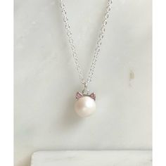 This adorable necklace is made with a SWAROVSKI® 8mm pearl charm with cat ear caps. The pearl is white with a hint of iridescent shine and has little pointed ears that have matching pink crystals. The charm hangs from an 18" silver-filled necklace in your choice of length. Cat Ears Cap, Pointed Ears, Cat Ear, Cat Necklace, Pearl Charms, The Pearl, Pink Crystal, White Pearl, Cat Ears