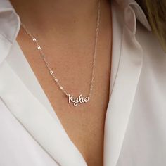 Sparkle like the coast of Italy with our beautiful Amalfi Name Necklace! Its delicate and dainty custom design will turn heads and inspire confidence, making you feel like you can conquer anything. Wear this personalized piece alone for everyday elegance or layer it with your favorite necklaces for an elevated look. Embrace the charm and sophistication of this stunning accessory. Custom Name Silver Necklace For Bridesmaid Gift, Silver Clavicle Chain Necklace For Bridesmaids, Name Necklaces For Bridesmaid Gift, Silver Name Necklace For Bridesmaid, Minimalist Name Necklace For Bridesmaids, Custom Name Jewelry For Bridesmaid Gift, Silver Name Necklaces For Bridesmaid Gift, Dainty Name Necklace For Bridesmaid Gift, Custom Name Necklace For Bridesmaid