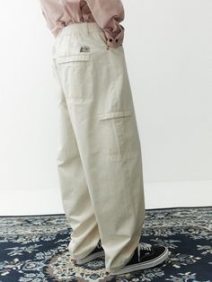 This is a casual and comfortable balloon pants that is made out of sturdy cotton 100% fabric. With soft touch of the fabric, elastic waistband, and hidden pocket, it can be easily styled for your daily outfit.- Washed cotton twill fabric for soft touch- Elastic waistband- Hidden pocket detail Spring Cotton Cargo Pants With Cargo Pockets, Spring Cotton Cargo Pants With Pockets, Baggy Cotton Cargo Pants For Spring, Cotton Cargo Style Parachute Pants With Straight Leg, Cotton Cargo Parachute Pants With Straight Leg, Cotton Straight Leg Parachute Pants, Cotton Straight Leg Cargo Parachute Pants, Spring Cotton Cargo Pants With Side Pockets, Cotton Cargo Trousers