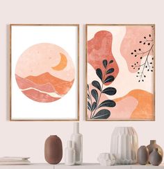 two framed art prints on a wall above a dresser with vases and other items