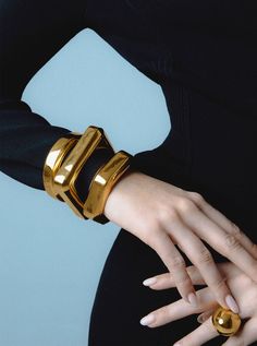 Gold Modern Cuff Bracelet For Formal Occasions, Modern Gold Cuff Bracelet For Formal Occasions, Gold Cuff Bangle For Evening, Modern Gold-tone Bangle For Formal Occasions, Modern Gold-tone Formal Bangle, Chic Evening Bracelets, Modern Gold-tone Bangle, Chic Cuff Bracelet For Evening, Classic Gold Bangle For Evening