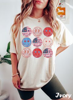 Smiley 4th of July Shirt ❤️ Every shirt is hand printed to order, we put so much love into making each shirt  ❤️ If for any reason the shirt didn't live up to your quality standards, contact us and we'll replace it or refund it ❤️ Feel free to send us your special request or if you have a unique idea for a shirt So it's that time again. You need to look for a new T-shirt to wear with your favorite jeans... for that effortless look 😥 You know, the kind that says I woke up like this but takes an Patriotic Summer T-shirt With Custom Print, White Custom Print Top For Independence Day, Trendy Cotton T-shirt For Independence Day, 4th Of July Cotton Tops With Custom Print, 4th Of July Cotton Tops With Screen Print, Independence Day Funny Print Short Sleeve T-shirt, Oversized Crew Neck Tops For 4th Of July, Oversized Casual Tops For 4th Of July, Casual Oversized Tops For 4th Of July