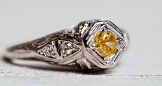 * VIEW A VIDEO OF THIS RING: https://youtu.be/51Y8HNsQSYQ * Extremely rare GIA CERTIFIED fancy intense orangy yellow diamond. The center stone is .20ct and is beaitufully surrounded by .07ct diamonds all near the upper shank. Hand crafted designed runs to the middle of the ring with custom breaks on the top and bottom of this unbelievable ring. It is very rare that we see such a color on a diamond. Fancy Intense is one of the most desirable color hue's in the world, and adding a the Orange tone Yellow Platinum Diamond Wedding Ring, Yellow Diamond Cut Platinum Ring, Yellow Platinum Diamond Ring With Diamond Cut, Yellow Platinum Diamond Ring Fine Jewelry, Luxury Yellow Diamond Hallmarked Ring, Yellow Platinum Diamond Ring, Fine Jewelry Yellow Diamond Platinum Ring, Luxury Yellow Diamond Ring Hallmarked, Platinum Rings With Yellow Diamond Accents