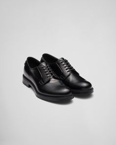 Brushed leather, traditionally used in fine classic footwear, has been reinterpreted by Prada since the 90s, using it on modern styles like these sleek lace-up shoes. Prada's emblematic triangle logo comes in an unexpected version, transformed into a rubber detail that decorates the heel. Product code: 2EG394_B4L_F0002_F_G000 Rubber triangle logo on the heel Rubber sole Sole height: 25 mm Leather insole Imported size 11 Shoes Logo, Size 11 Heels, Triangle Logo, Derby Shoes, The 90s, Lace Up Shoes, Derby, Rubber Sole, Prada