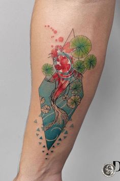 a woman's leg with a tattoo on it and an image of a fish in the water