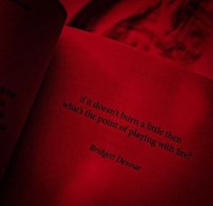 an open book with a red light shining down on it's pages that read, if i doesn't turn a little then what the point of playing with fire?