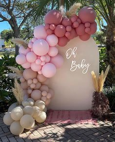 balloon arch for baby shower with pink and white balloons