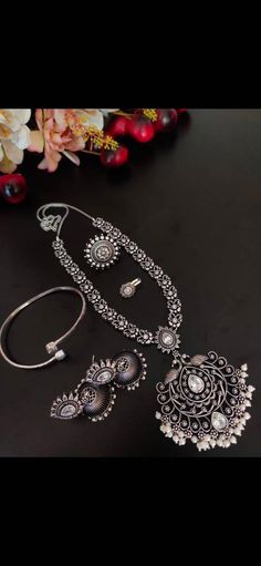 This beautiful set of 5 has a big long Haram necklace, pair of jhumka earrings, a ring,bracelet, and a nose pin. Grab this beautiful set with any of the ethnic/ Indo western outfit and look unique in the crowd Premium quality set!! Bohemian Silver Jewelry Sets With Stone Work, Bohemian Silver Kundan Necklace With Stone Work, Jewelry Long Necklace, Long Necklace Set, Flatware Jewelry, Oxidised Silver Jewelry, Temple Jewelry, Boho Choker, Dresses Indian