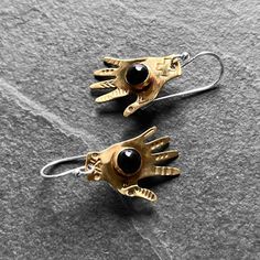 Handmade Symbolic Black Earrings, Symbolic Black Hand Cast Jewelry, Black Hand Forged Dangle Jewelry, Hand-cast Brass Dangle Earrings, Hand Forged Black Earrings As A Gift, Hand Forged Black Earrings For A Gift, Black Brass Spiritual Jewelry, Artisan Black Brass Jewelry, Symbolic Hand Forged Black Jewelry