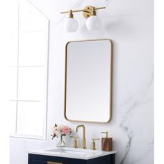 a bathroom vanity with a mirror and two lights