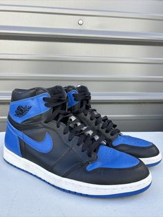 Elevate your sneaker game with these Jordan 1 Retro High OG Royal 2017 sneakers. These shoes are perfect for any occasion, whether it's activewear or casual wear. The black leather upper material and solid pattern make these sneakers versatile yet stylish. Featuring a lace-up closure and high-top shoe shaft style, these sneakers offer both comfort and ankle support. The rubber cleat type and outsole material provide durability and traction for gym and training activities, track and field, walking, skateboarding, yoga, and basketball. These Air Jordan 1 Retro High OG Royal 2017 sneakers are a must-have for any sneakerhead. Comes with replacement box Sporty Leather Jordan Shoes, Sporty Leather Jordan Shoes With Laces, Leather Sporty Jordan Shoes, Lace-up Jordan Shoes With Contrast Sole For Light Sports, Leather Jordan Shoes With Laces For Streetwear, Jordan Lace-up Shoes With Boost Midsole For Streetwear, Custom Low-top Training Sneakers, High-top Jordan Shoes With Contrast Sole For Sports, Dynamic Jordan Shoes For Streetwear