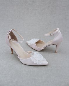 Classic satin pointy toe heels adorned with large white pearl primrose flower applique. Sleek and glamour is a great combination and will definitely be a favorite. DETAILS: HEELS: 3 inches COLORS AVAILABLE: Dusty Pink, Light Blue, Black, Champagne, Ivory, and White UPPER: Synthetic upper and lining MATERIALS: Manmade outsole ORIGIN: Imported STYLE NAME: BELL Low Heel Satin Wedding Heels, Satin Low Heel Wedding Heels, Satin Closed-toe Wedding Shoes, Satin Closed Toe Wedding Shoes, Satin Wedding Shoes With 4-inch Heel, Closed Toe Satin Heels For Wedding, Satin Closed Toe Heels For Wedding, Satin Closed-toe Bridesmaid Wedding Shoes, Elegant Satin Wedding Shoes