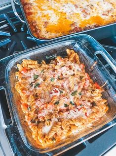 two pans filled with food sitting on top of a stove next to each other