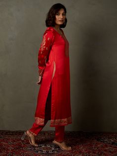 Editor's Note Elevate your ethnic look with our red ari-hand embroidered girija kurta, paired with churidar and a coordinating dupatta. This ensemble combines traditional charm with intricate hand embroidery, perfect for special occasions and celebrations. Fabric: Silk satin Color: Red Components: Kurta, churidar and dupatta Occasion: Festive Note: Product colour may slightly vary due to photographic lighting sources Care: Dry clean only About the DesignerRi Ritu Kumar is one of India’s foremost Slub Silk Anarkali Set With Embroidered Border, Designer Chanderi Palazzo Set With Embroidered Border, Diwali Slub Silk Kurta With Embroidered Border, Red Embroidered Slub Silk Kurta, Designer Red Cotton Silk Churidar, Bollywood Cotton Silk Palazzo Set With Embroidered Border, Traditional Slub Silk Churidar With Embroidered Border, Cotton Silk Sharara With Embroidered Border For Festivals, Traditional Cotton Silk Palazzo Set With Embroidered Border