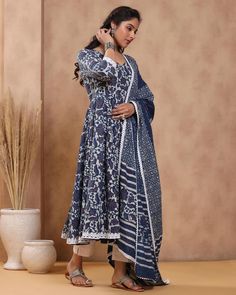 This is a beautiful 3-piece anarkali suit set. The set includes anarkali kurta with 32 kali has round neck, 3/4th sleeves & calf length teamed with solid cotton pants with elasticated waistband and a cotton printed dupatta with lace detailing. 3-piece set Suit Fabric-Cotton Dupatta Fabric-Cotton Length-Calf Length Color - Blue & White Neck-Round Neck Sleeves - Sleeves Washing Care-Dry Clean or Quick Deep Wash DISCLAIMER - The color of the product may be differ due to screen settings of device. Indigo Kurta With Dupatta For Eid, Eid Indigo Kurta With Dupatta, Eid Special Indigo Kurta With Dupatta, Indigo Salwar Kameez With Dupatta For Navratri, Navratri Indigo Salwar Kameez With Dupatta, Indigo Dabka Straight Kurta, Indigo Straight Kurta With Dabka, Indigo Anarkali Traditional Wear With Dupatta, Festive Indigo Anarkali Set With Dupatta