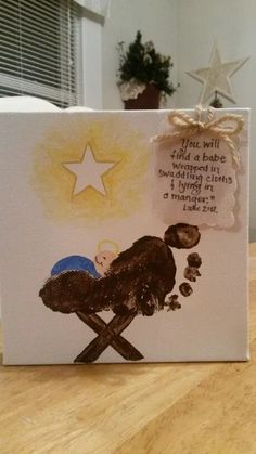 a card with an image of a baby in a manger written on the front