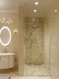 a bathroom with a round mirror above the sink and a walk - in shower next to it