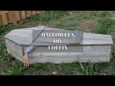 a wooden box sitting in the grass with text overlay that reads halloween diy coffin