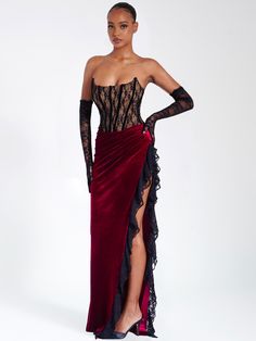 Live life like royalty with this divine piece! Featuring a strapless corset, high side slit, exposed velvet boning, and slight ruching details across the 'V' shaped waistline, it's sure to make you look and feel like a queen. Fully boned and lined with a nude-colored lining, this stunning dress is perfect for any special occasion. Now get out there and make an unforgettable statement! Pair it with our Rae Black Lace Opera-length Gloves! Available in black and red. Materials: Lace / Stretch Velve Party Maxi Dresses, Boudiour Poses, Split Dress Thigh, Velvet Patchwork, Fitted Gowns, Velvet Corset, Red Corset, Ballroom Dancing, Strapless Corset