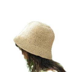 This hat is handmade and crafted from raffia yarn. Raffia yarn is a natural and durable material, ensuring the hat's longevity. The beige color and simple design make it an ideal accessory for both everyday use and outdoor activities like the beach. The wide-brim bucket shape provides sun protection and offers a stylish look. Its comfortable and lightweight structure ensures easy and prolonged wear. Raffia. You can store this hat, knitted from raffia rope, in a breathable cloth bag, protect it from fire and heat, and wipe the stains with a clean damp cloth. Natural Crochet Hat With Curved Brim, Natural Curved Brim Crochet Hat, Natural Woven Wide Brim Bucket Hat, Wide Brim Natural Woven Bucket Hat, Natural Wide Brim Toquilla Straw Bucket Hat, Wide Brim Woven Bucket Hat In Natural, Brimmed Woven Toquilla Straw Bucket Hat, Natural Woven Bucket Hat With Short Brim, Natural Straw Bucket Hat With Curved Brim