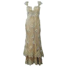 This Barraci gown is composed of a gold and yellow lace/silk combination which is embellished with rhinestones. There is a boned foundation, center back zipper closure, and corset style lace up back. In excellent vintage condition. **Please cross-reference measurements for personal accuracy. Measures (Approximately) Length: 53" Center Front 7" Train Bust: 34" Waist: 30" Hip: 37" Styling Lookbook, Evening Gowns Gold, Gold Lace Dress, Visenya Targaryen, Yellow Corset, Embellished Corset, Gold Lace Dresses, Dresses Yellow, Gown Gold