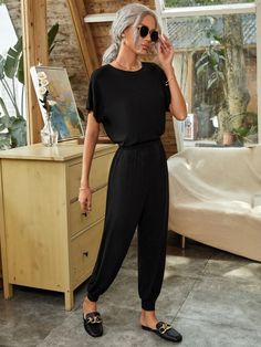 Each occasion is appropriate for this black Solid Keyhole Back Elastic Waist Jumpsuit. It's a terrific option for warm days because of the short sleeves and round neckline, and the high waist and regular fit give you a figure-flattering silhouette. This is a fantastic choice for all-day wear because of the high-stretch fabric's softness and comfort. This black shirt will undoubtedly become a wardrobe standard, regardless of your own style. Specifications: Sleeve Length: Short Sleeve Neckline: Ro Black Solid, Batwing Sleeve, Black Fits, The High, Jumpsuits For Women, Round Neckline, Black Shirt, Black Fashion, Stretch Fabric