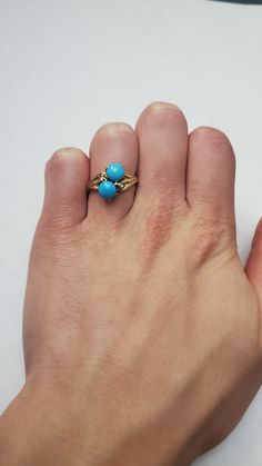 Vintage 10k Persian Turquoise With Small Diamond Ring Signed WR AS To MG Total size: Length 2 x Width 1.1 x Height 0.1 inches Ring size: US 5 Turquoise size: 4.5mm Total weight: 3 grams Signed: WR AS TO MG Hallmarked Turquoise Ring Fine Jewelry, Hallmarked Turquoise Fine Jewelry Ring, 14k Gold Multi-stone Turquoise Jewelry, Turquoise Multi-stone 14k Gold Jewelry, Gold Turquoise Ring Hallmarked Fine Jewelry, Gold Hallmarked Turquoise Ring Fine Jewelry, Classic Gold Turquoise Ring With Round Shape, Heirloom Turquoise Rings Hallmarked, 14k Gold Turquoise Jewelry With Accent Stones