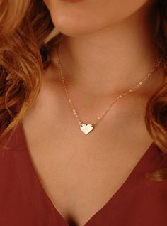 "A beautiful Medium Heart Necklace in Gold-Filled, Sterling Silver, or Rose Gold-Filled. The heart can be personalized with a symbol, single initial, or with 2 tiny letters. Choice of smooth or hammered finish. About the Medium Heart Necklace: - 14K Gold-Filled, Sterling Silver, or 14K Rose Gold-Filled Heart (shown in photo), in 20g thickness - 1.6mm Flat Cable Chain - your choice of length from 14\" - 20\" (Model is wearing about a 17\" chain) - The heart disc measures 11mm x 13mm - Beautifully Dainty Heart Pendant Jewelry With Birth Flower, Dainty Rose Gold Jewelry With Heart Charm, Delicate 14k Gold Filled Charm Necklace For Anniversary, 14k Gold Heart Charm Necklace For Wedding, Personalized Delicate 14k Gold-filled Charm Necklaces, 14k Gold Filled Heart Charm Jewelry For Wedding, 14k Gold Filled Charm Necklace For Valentine's Day Gift, Dainty Initial Pendant Jewelry For Valentine's Day, Personalized Delicate 14k Gold-filled Charm Necklace