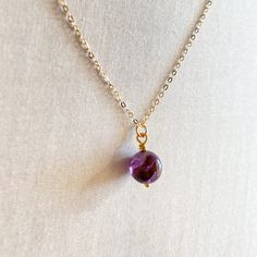 This Auralite 23 necklace is made from a single Auralite Amethyst crystal. You can find 23 different type of minerals in this crystal. It's formed 1.2 billion to 2 billion years ago. DETAILS- Genuine Auralite 23- Auralite 23 size: approximately 8mm- Made in gold filled - 18" long- Ready to ship in 2 - 5 business days Round Mineral Crystal Gemstone Necklace, Amethyst Gemstone Crystal Necklaces With Round Beads, Amethyst Crystal Necklace With Natural Stones, Amethyst Crystal Necklaces With Natural Stones, Gift Amethyst Necklaces With Round Beads, Round Amethyst Crystal Necklaces With Natural Stones, Spiritual Birthstone Necklace With Mineral Crystal, Faceted Amethyst Necklaces For Jewelry Making, Spiritual Birthstone Necklaces With Round Beads