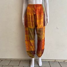 Earth toned patchwork pants  Stonewashed to create a unique design  Easy to wear with an elastic waist and drawstring  Lightweight and casual so it's easy to wear  Hippie/Boho style pants. 100% Rayon One size  Length 40in Made in Nepal 🇳🇵  Please message with any questions! #hippie #cottonpants #boho #patchwork #nepal Casual Patchwork Harem Pants, Multicolor Relaxed Fit Bottoms With Drawstring, Bohemian Drawstring Trousers, Casual Multicolor Drawstring Pants, Bohemian Relaxed Fit Harem Pants With Drawstring, Casual Festival Pants With Patchwork, Casual Patchwork Pants For Festival, Bohemian Harem Pants With Drawstring Wide Leg, Bohemian Wide Leg Harem Pants With Drawstring